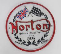 A contemporary cast metal Norton sign.