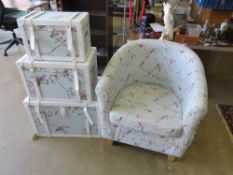 A graduating set of three fabric covered trunks, powder blue ground with birds and foliage upon,