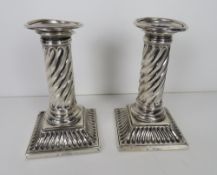 A pair of HM silver Victorian short candlesticks each having square shaped base with twist