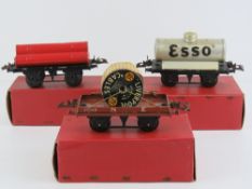 A Hornby 0 gauge gas cylinder wagon together with a flat truck with cable drum and a number one