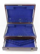 A two tier mahogany flatware box having lid opening to reveal fitted compartment with drawer under,