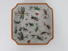 An Oriental dish decorated with insects upon, four character mark to base.