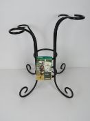 A black painted metal wine caddy, as new with label.