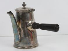 A silver plated hot chocolate pot having ebonised wooden side handle, standing 17.5cm high.