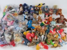 A quantity of assorted McDonald's soft toys inc Ty beanie babies, Wombles, Disney etc.