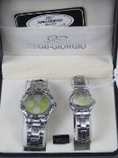 A 'His and Hers' stainless steel gents wristwatch and ladies wristwatch set, in presentation box.