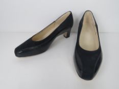 A pair of as new leather shoes.