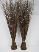 Two decorative displays studded with faux pearls.