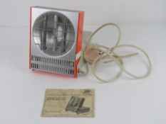 A vintage Combined Ultra Violet Infrared Health Lamp with original booklet.