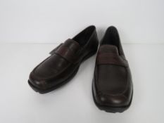 A pair of as new leather shoes.