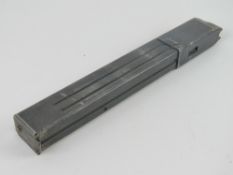 An WWII German MP38/ MP40 magazine dated 1942 and having German markings upon.