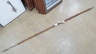 A re enactor's military parade lance with spike top and base.