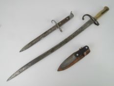 A quantity of assorted edged weapons including; two bayonets, knife, 1886 French bayonet,