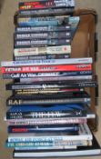 A box containing a quantity of assorted military and aviation themed books.