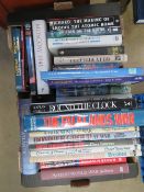 A box containing a quantity of assorted military and aviation themed books.
