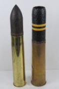 An inert WWI British 18lb shell 51cm high, together with a 75mm shell with head 53cm high.