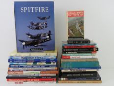 A box containing a quantity of assorted military themed books.
