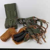 Ten PPS 41 slings together with ten ammo pouches and ten magazines.