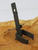 A Bren drum magazine adapter in stores packaging.