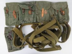 Five AK mag pouches together with ten AK slings.