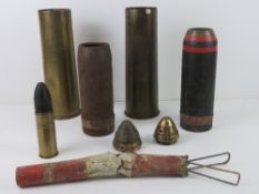 A box containing assorted inert shells; 18lb shell with head and fuse dated 1917,