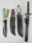 A bone handled dagger having raindrop Damascus blade with leather sheath,