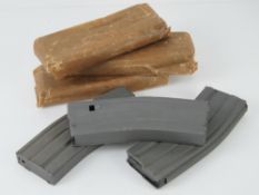 Six unissued M16 magazines.