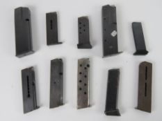 Ten assorted pistol magazines.