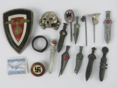 A quantity of assorted re enactor's German badges inc miniature swords, reproduction day badge,