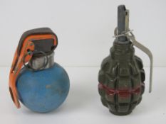 An inert British military L111 A1 B1 practice grenade together with an inert F1 limonka grenade.