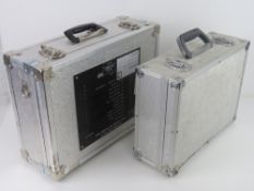 Two ex military flight cases measuring approx 37 x 29cm and approx 46 x 34 cm.