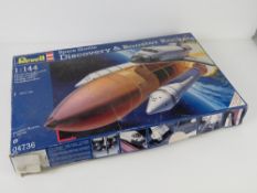 Scale model, Space Shuttle Discovery and booster rockets by Revell, 1:144, unbuilt in box, box a/f.