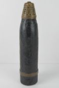 An inert WWI French 75mm anti-aircraft round, 31cm in length.