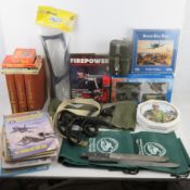A box containing a quantity of assorted military items inc toys, puzzles, slings, stock, plate,
