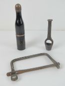 A kit bag handle together with a 15mm wad cutter together with a Franco-British Exhibition London