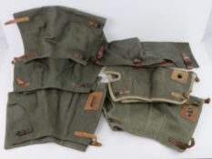 A quantity of six MG42 canvas breach covers with leather straps.