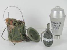 Three inert items; F1 Limonka grenade, AT2 Anti-Tank Mine,