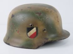 A reproduction double decal M40 camo helmet.
