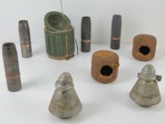 An inert AT2 anti tank mine, together with two WWII German butterfly bombs in relic condition,