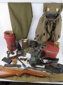 An assorted box of WWII Militaria; PPSH-4 drum magazine pouch, two spike bayonet scabbards, slings,