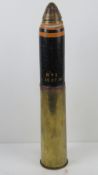 An inert WWI British shell dated 1918 with head and fuse, 58cm high.