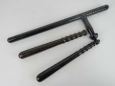 A US police baton marked Monadnock Pr-24-S approx 60cm in length.