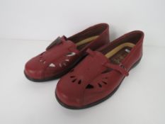 A pair of as new leather shoes.