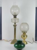 A brass oil lamp having clear glass rese