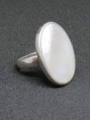 A silver and mother of pearl ring, stamp