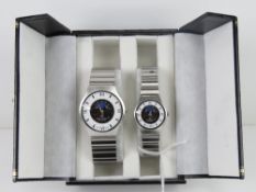 A 'His and Hers' stainless steel gents w