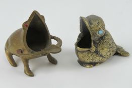 Two brass smoker's receptacles in the fo