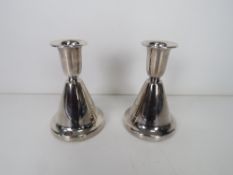 A pair of silver Chrisophersen short can