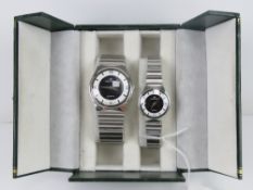 A 'His and Hers' stainless steel gents w