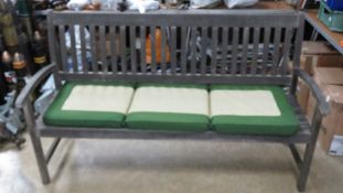 A wooden garden bench with associated th